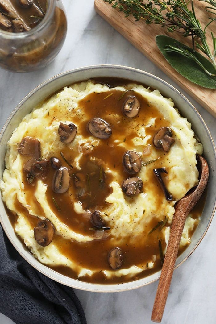 Vegetarian Mushroom Gravy over mashed potatoes in a bowl. 