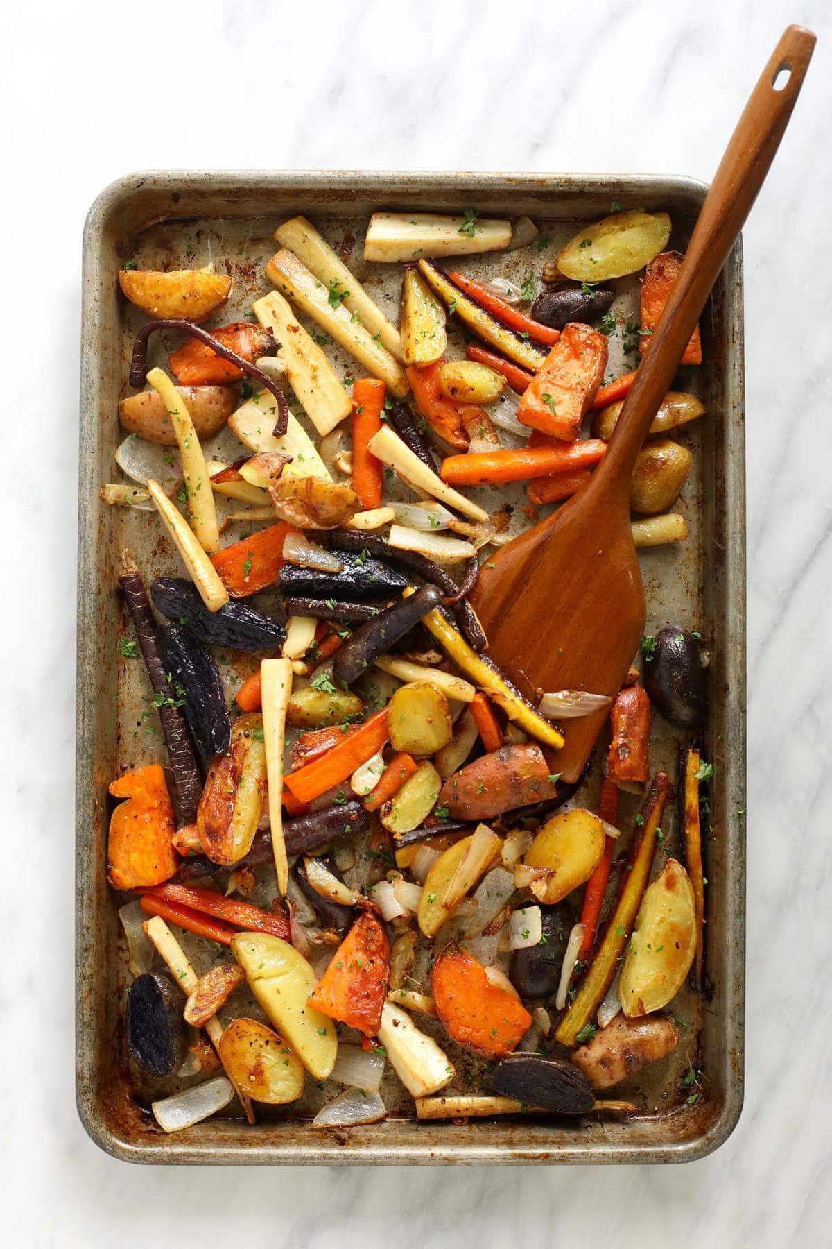 Roasted root vegetables on a baking sheet