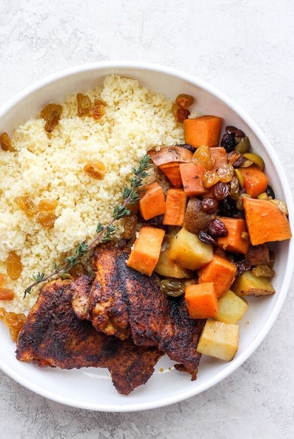 Moroccan chicken served with couscous and vegetables.