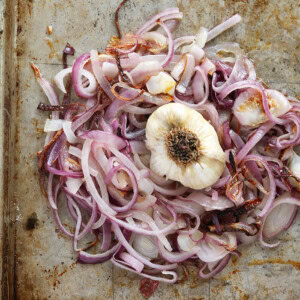 Caramelized onion and garlic on a baking sheet.