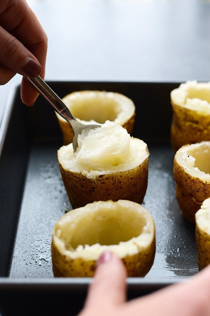 twice baked potatoes with innards being scooped out