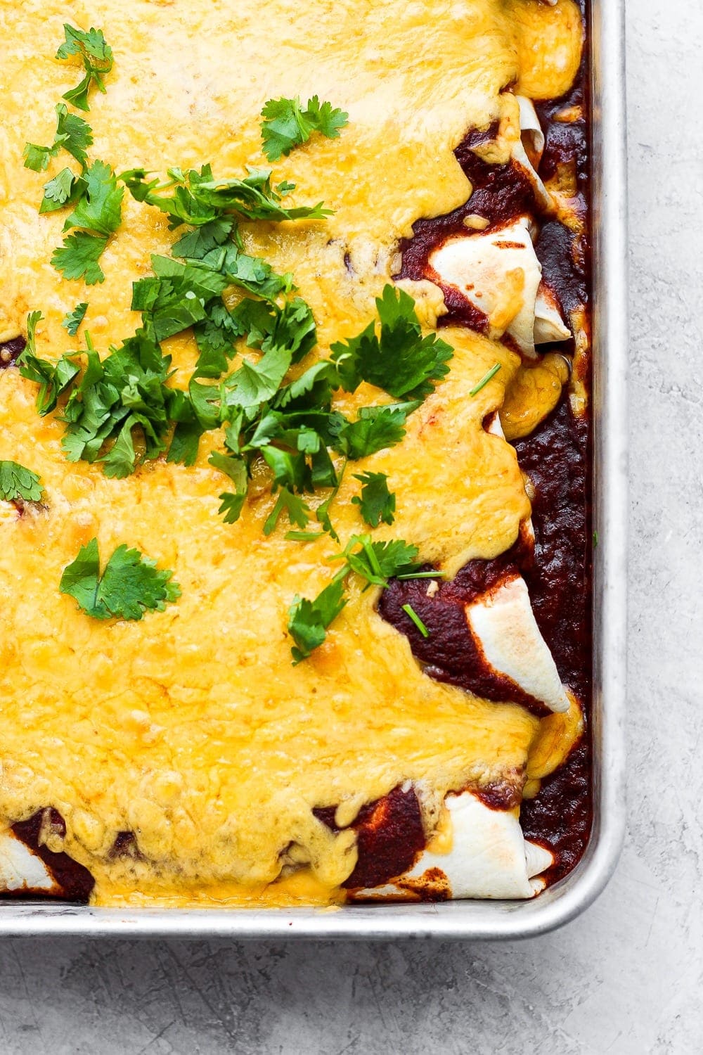 rotisserie chicken enchiladas in pan