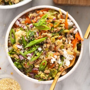 egg roll in a bowl served with rice