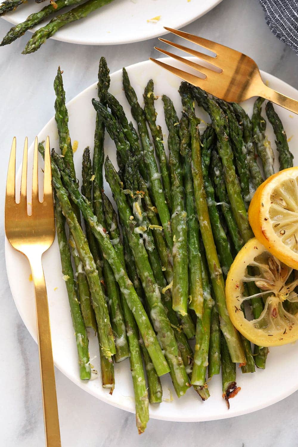 Oven roasted asparagus on a plate.