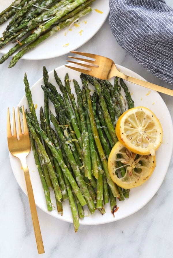 Roasted asparagus on plate with lemon