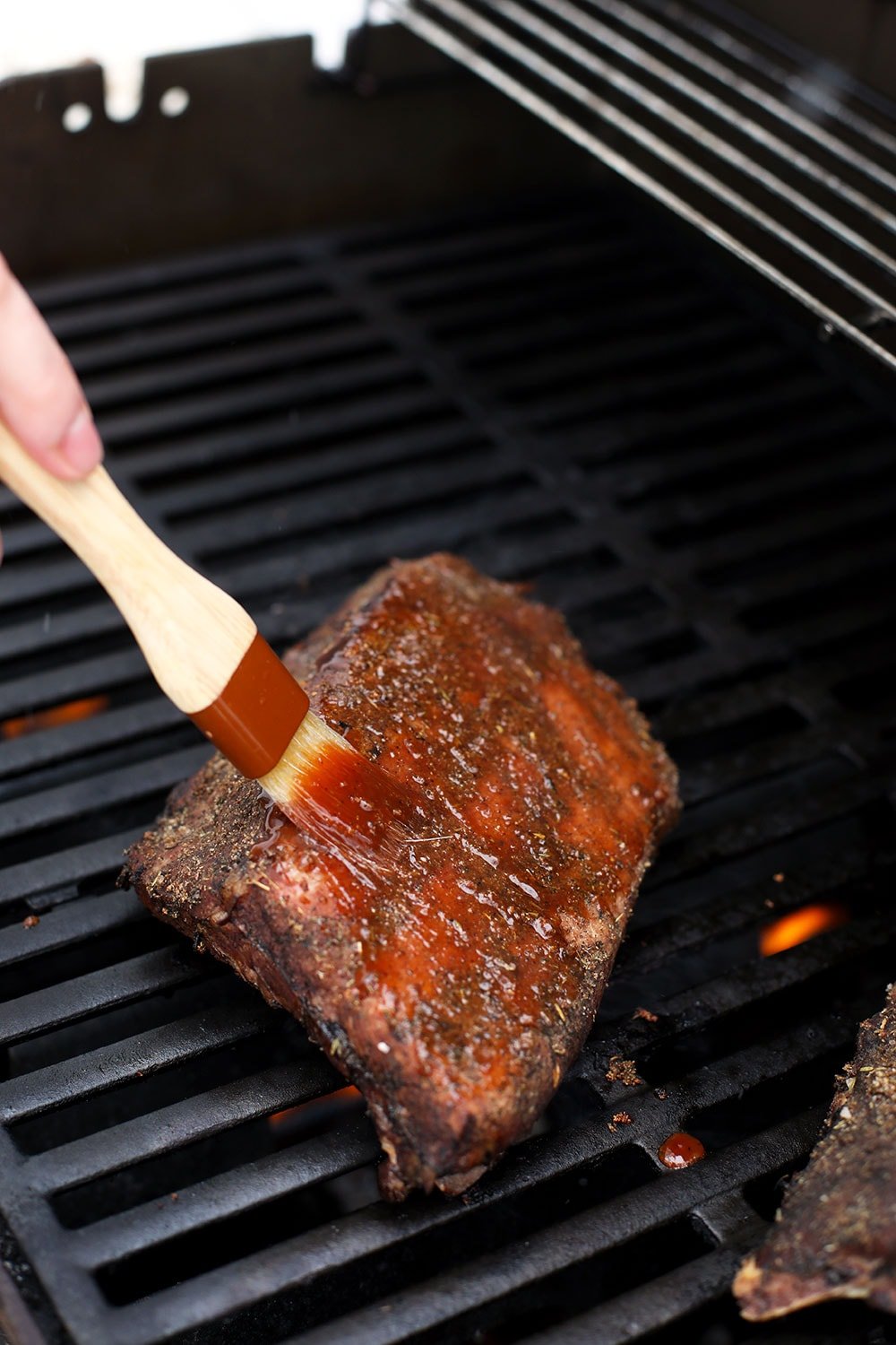 Brushing the sous vide ribs with bbq sauce. 