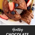 healthy chocolate pancakes topped with fresh fruit slices