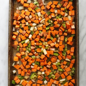 raw veggies on baking sheet.