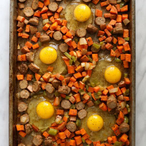 eggs and veggies on baking sheet.