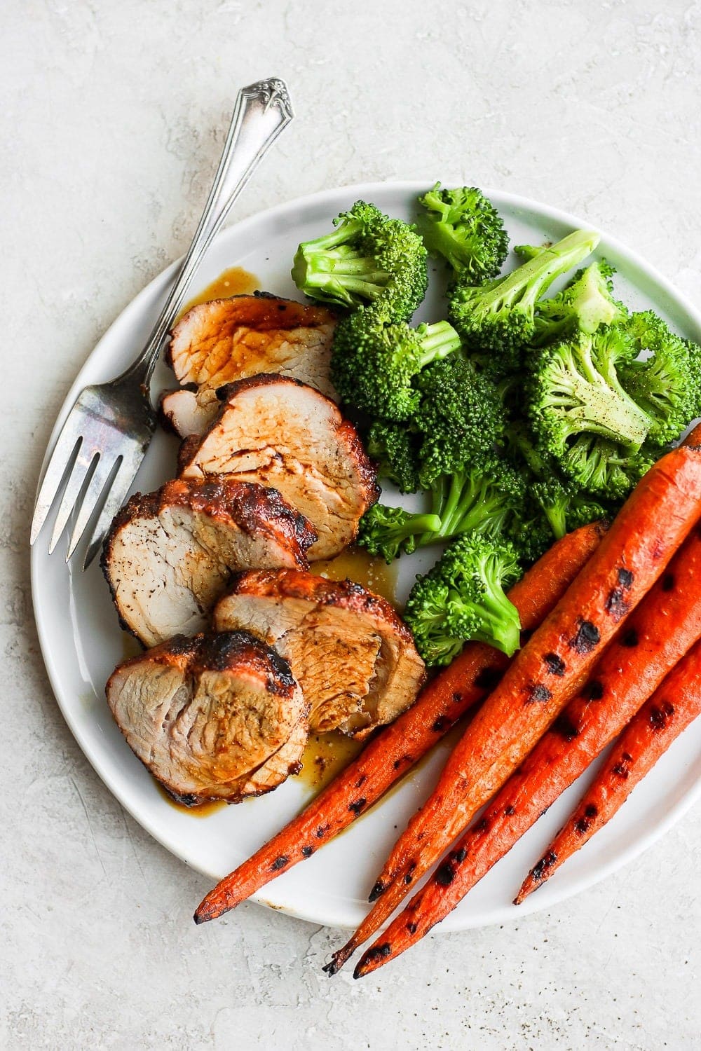 sliced pork tenderloin with veggies.