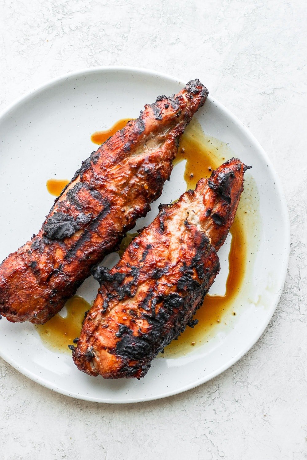 grilled pork tenderloin on plate.