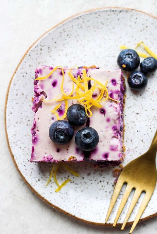 blueberry cheesecake bar on a plate ready to enjoy