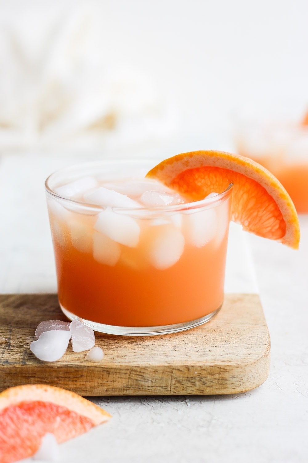 paloma cocktail with a slice of grapefruit garnished on the edge of the glass