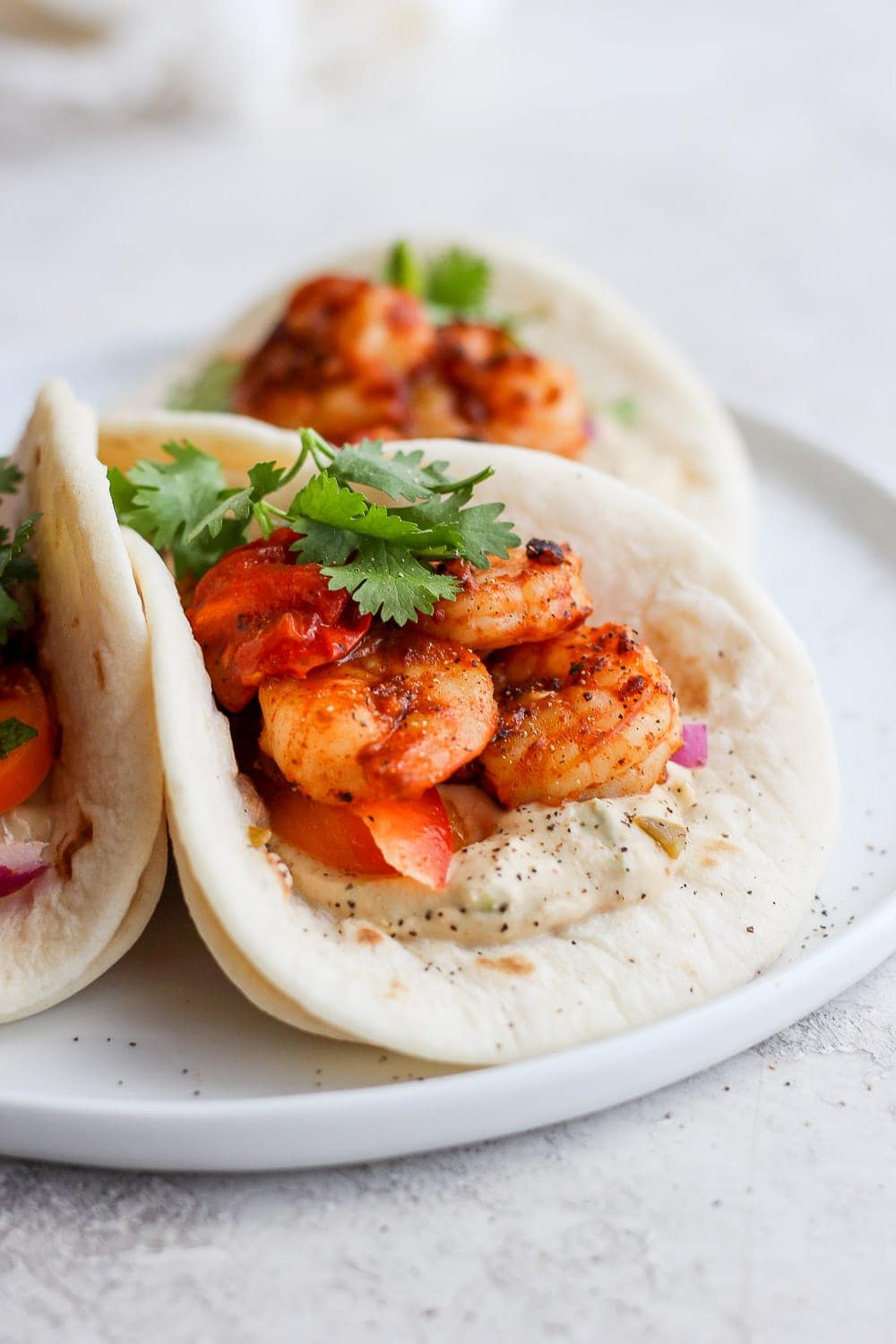 shrimp tacos in a street taco tortilla looking delicious