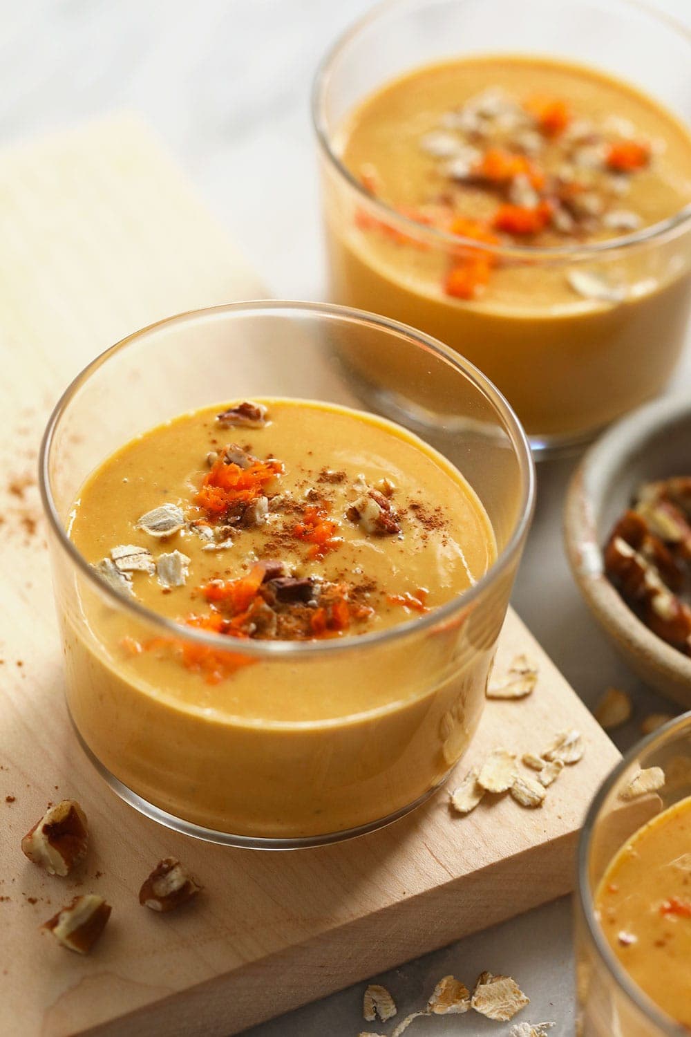 Carrot cake smoothies in two glasses. 