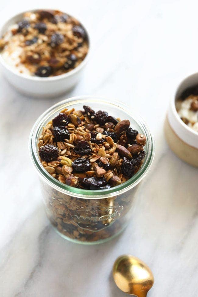 cherry pistachio granola in a glass jar