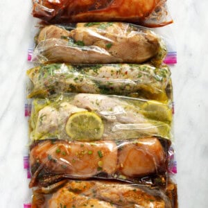 6 chicken marinades in plastic bags.