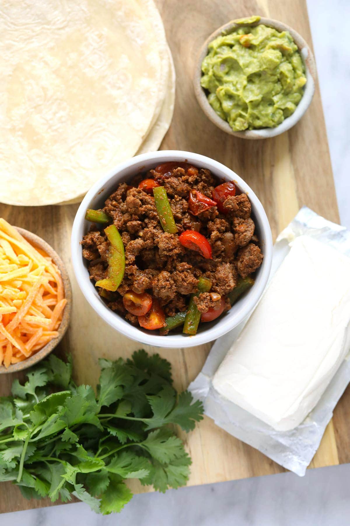 chicken quesadilla ingredients ready to be placed on a tortilla