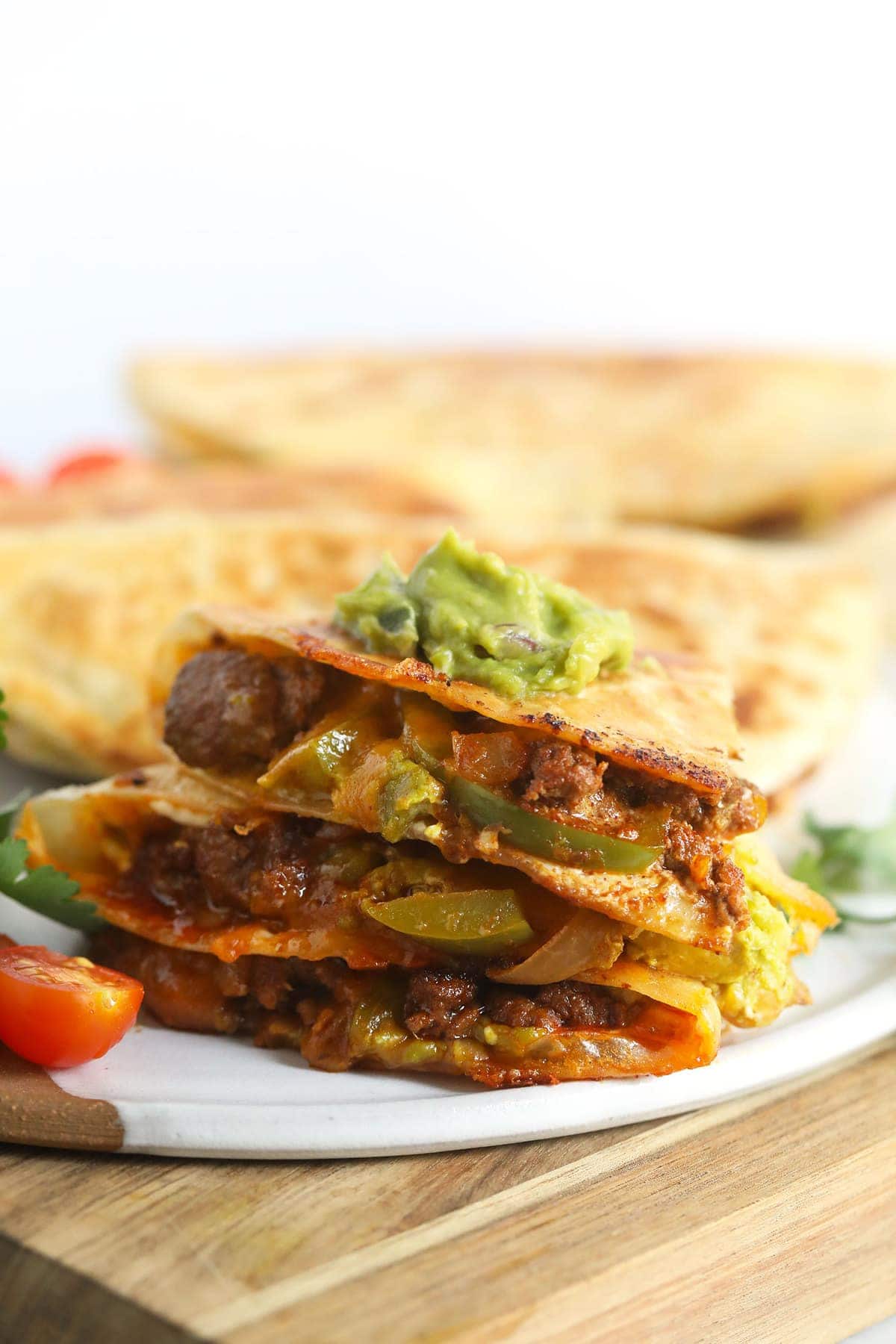 chicken quesadilla topped with guacamole