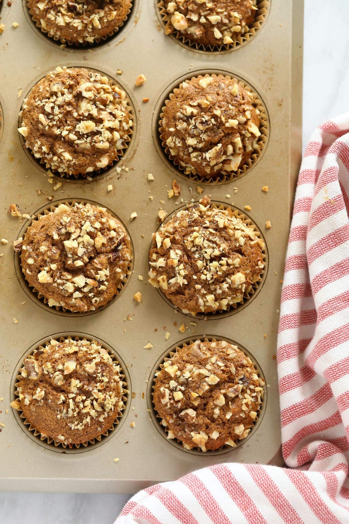 Banana nut muffins in a muffin tin. 