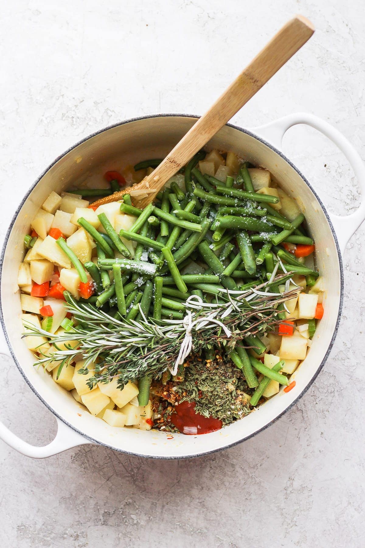 All the ingredients for vegetable soup in a Dutch oven. 