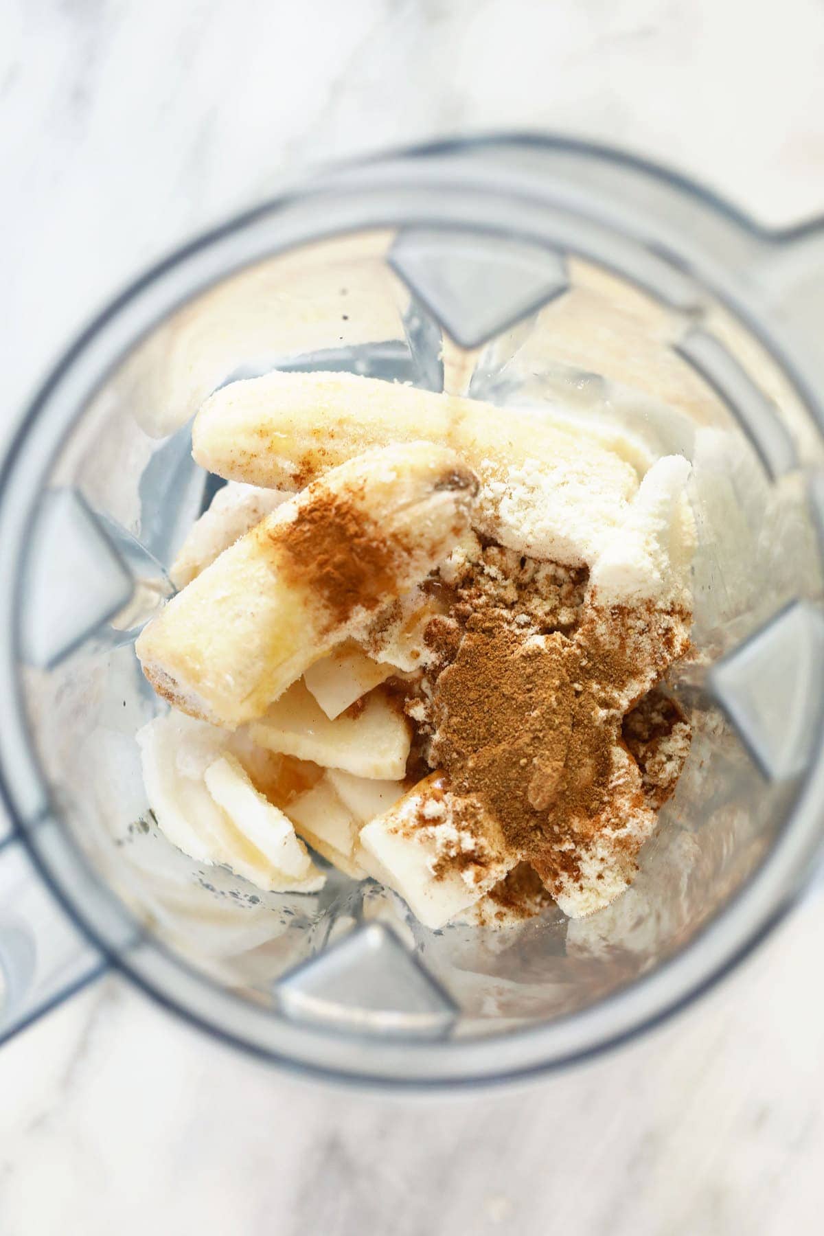 All the ingredients for the chai protein shake in a blender. 