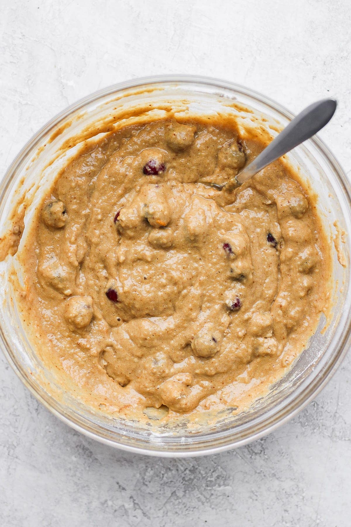 cranberry orange bread batter mixed in a bowl