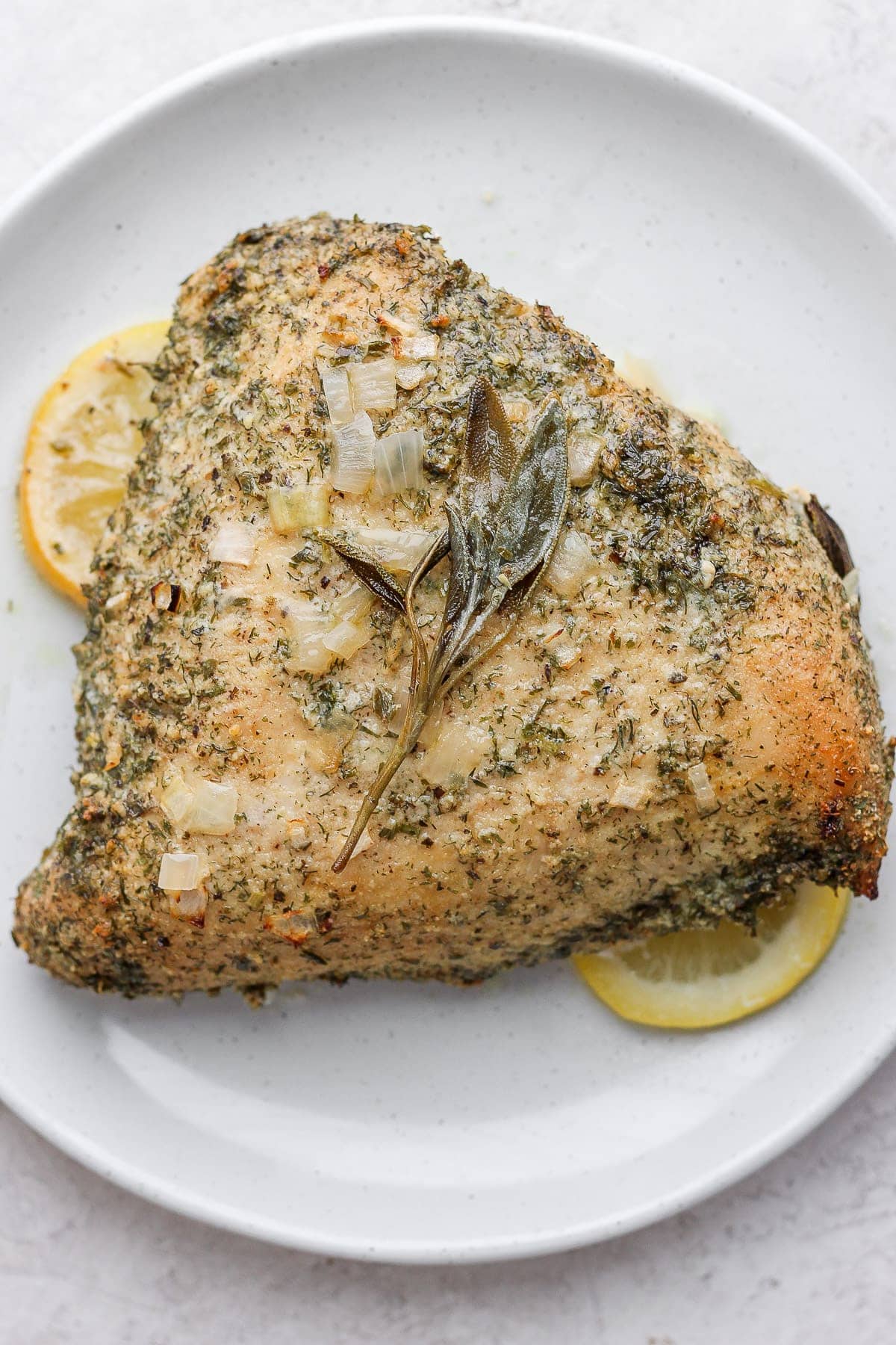 A roasted turkey breast on a serving platter. 