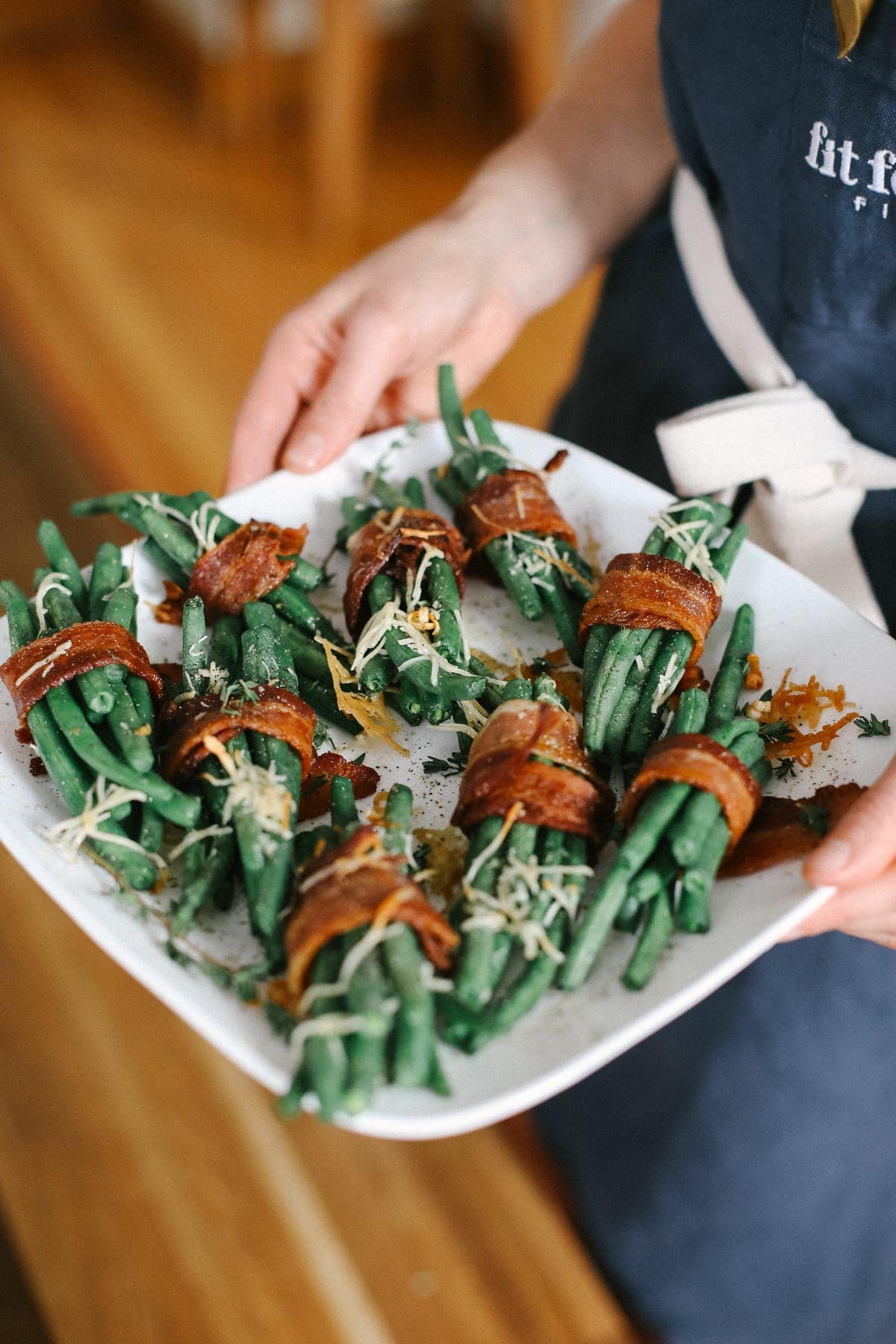 bacon wrapped green beans on a plate ready to be served