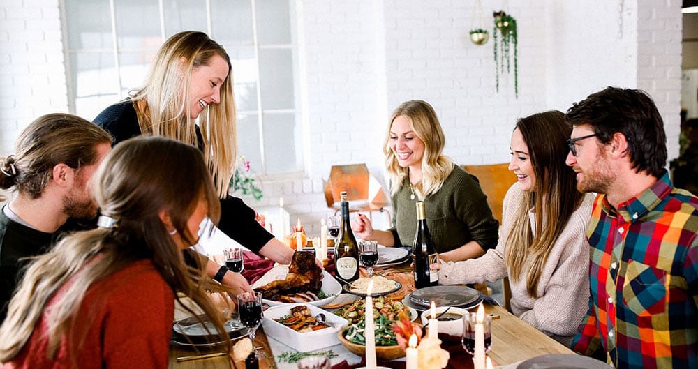 people gathering at table.