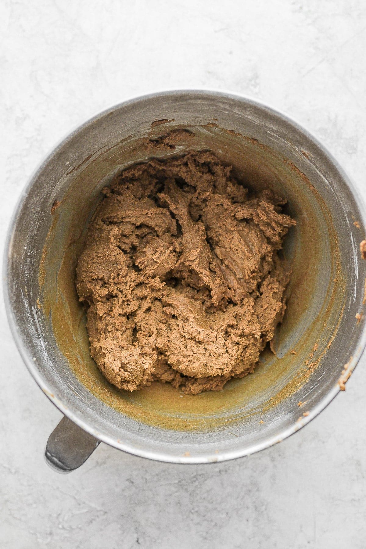 Gingerbread cookie dough in a mixing bowl. 