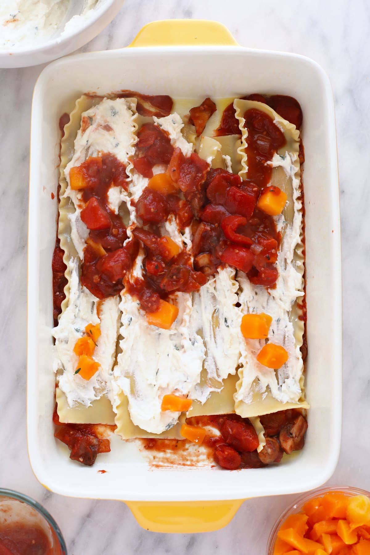 Building a butternut squash lasagna in a 9x13 pan.