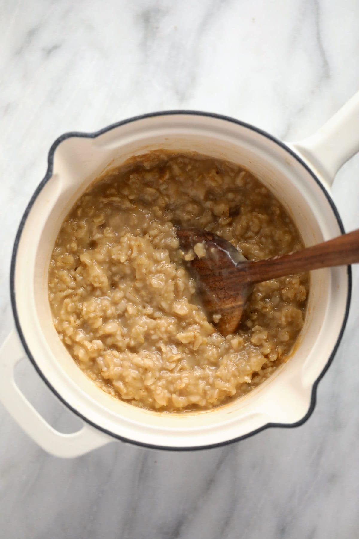 Creamy savory oatmeal in a small pot. 