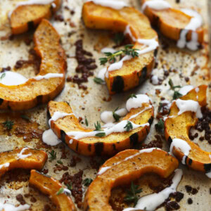 delicata squash roasted on a pan