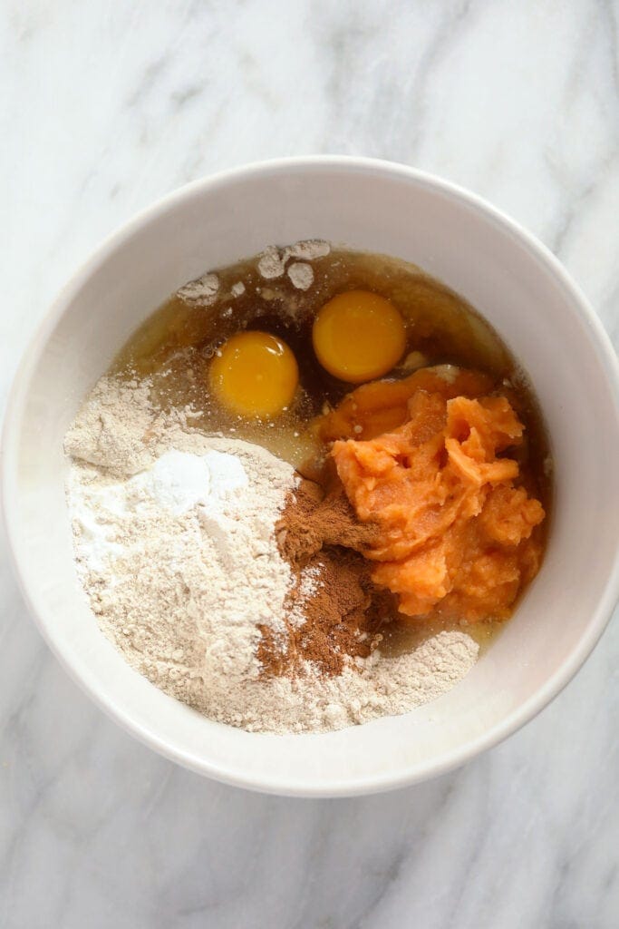 Ingredients for sweet potato pancakes in a bowl. 