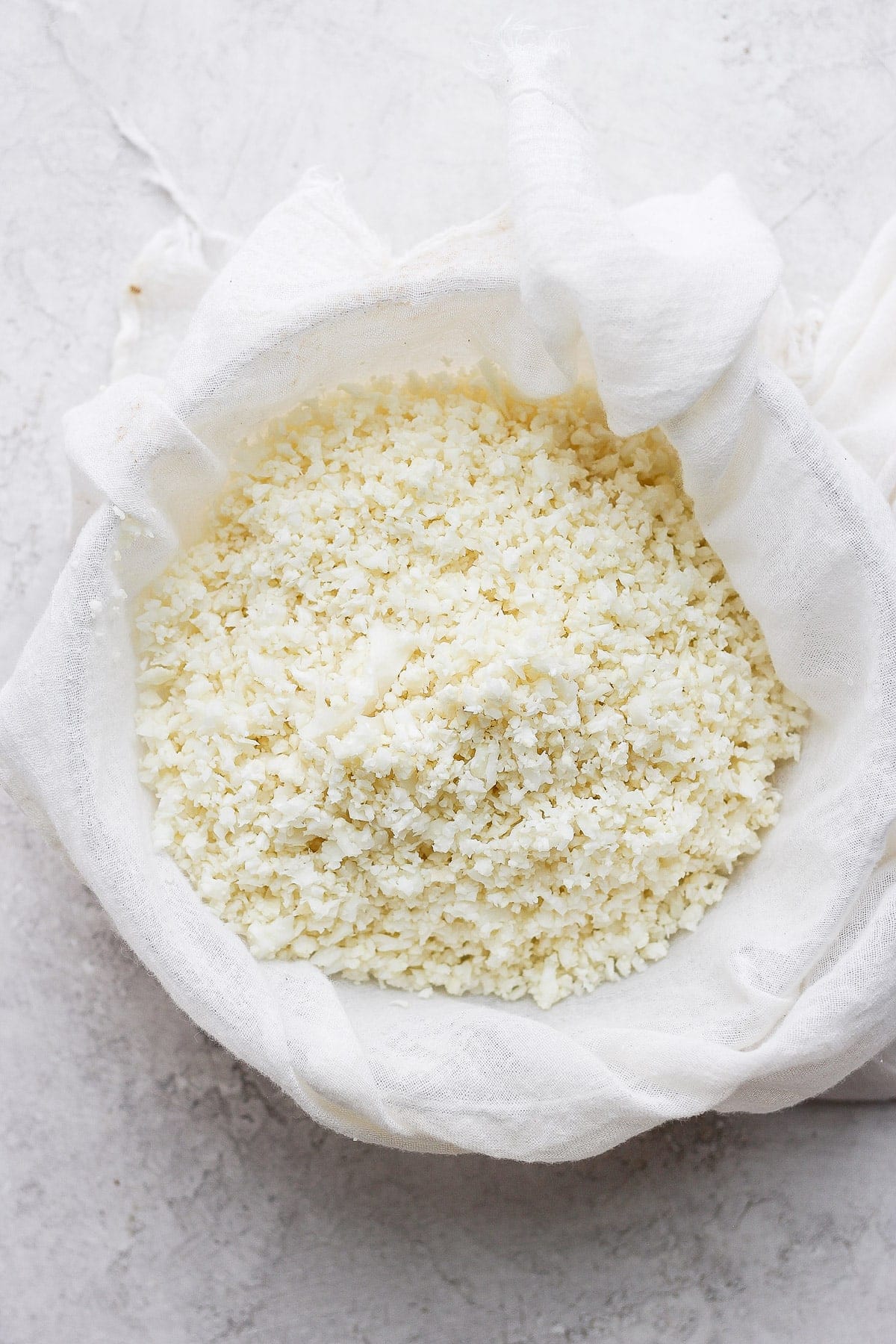 Cauliflower rice in a tea towel. 