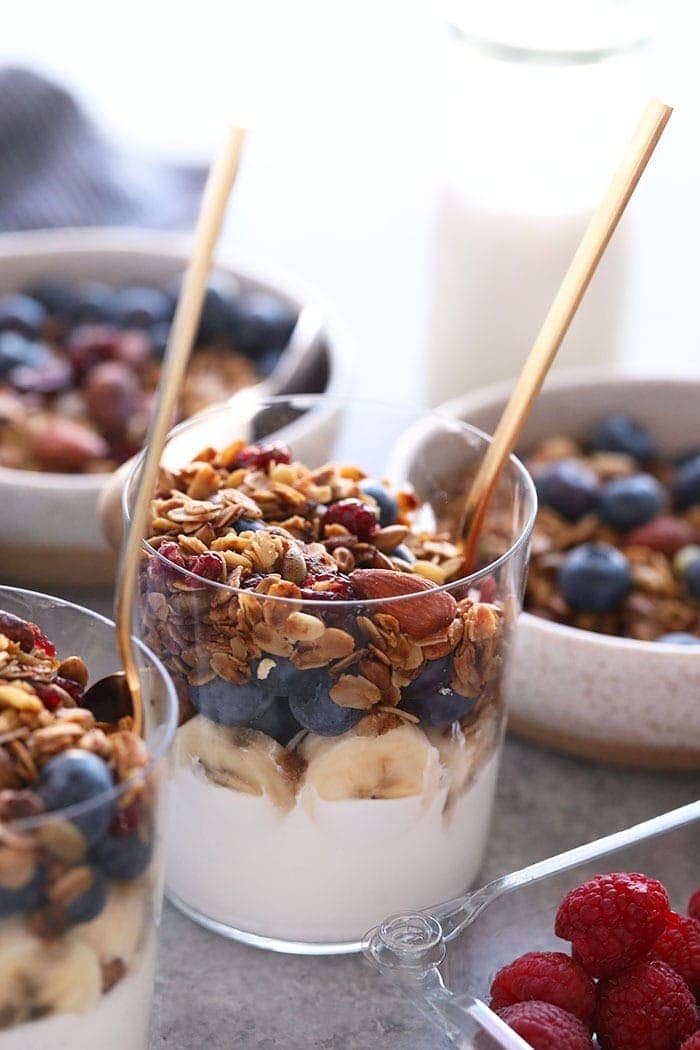 granola in cup on yogurt