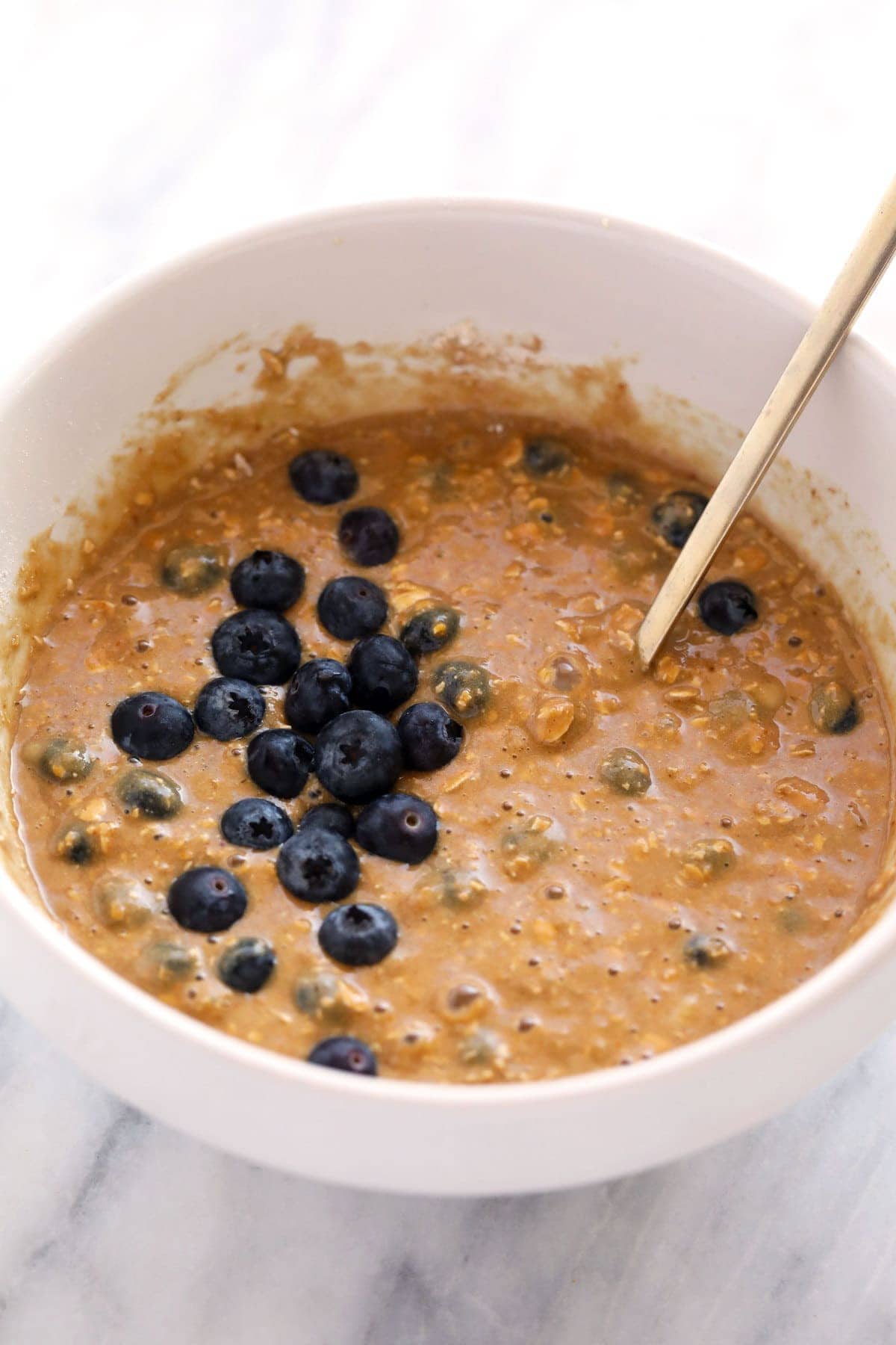 blueberry oatmeal muffin batter in a bowl