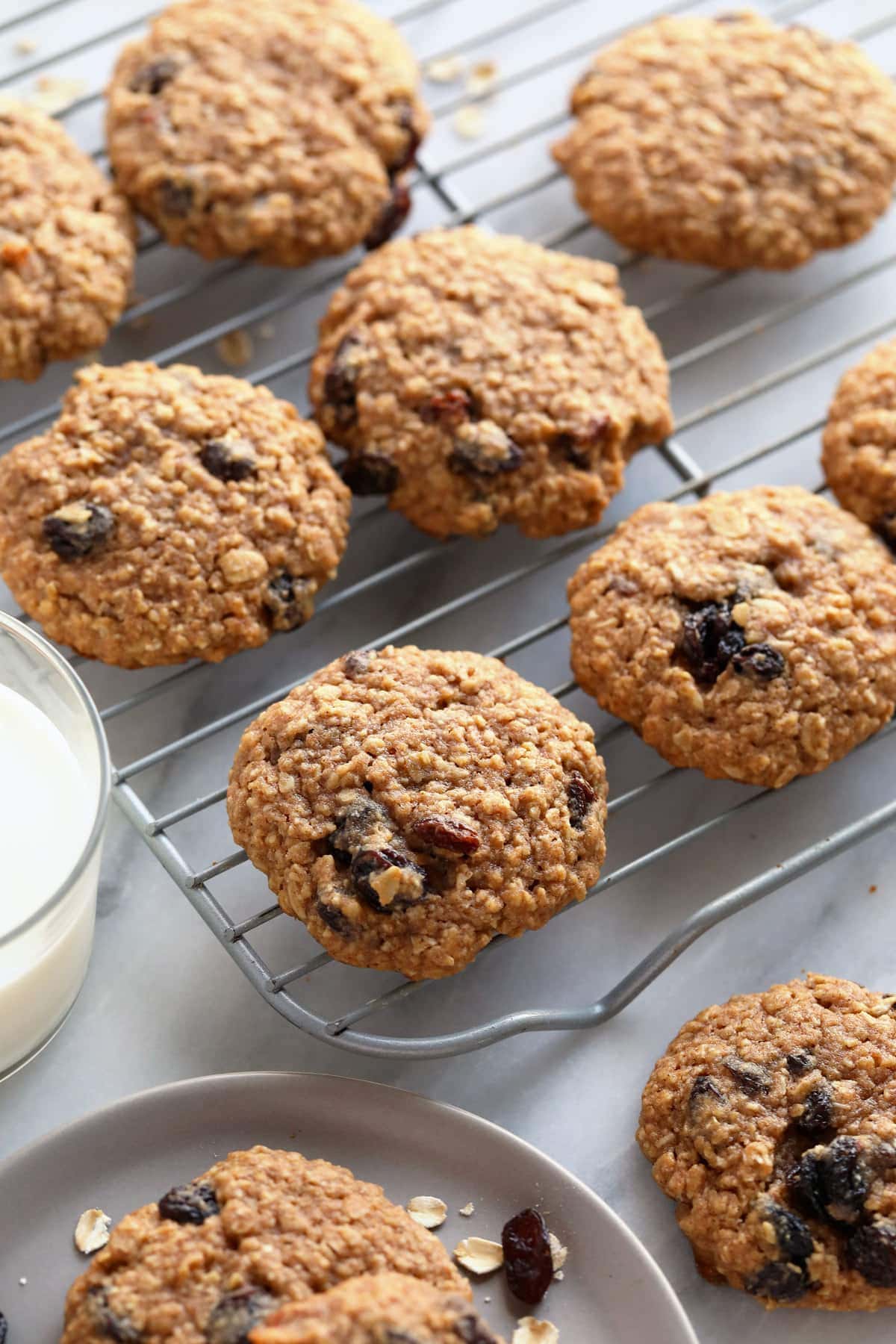 Oatmeal raisin cookies on a cooling rack. 