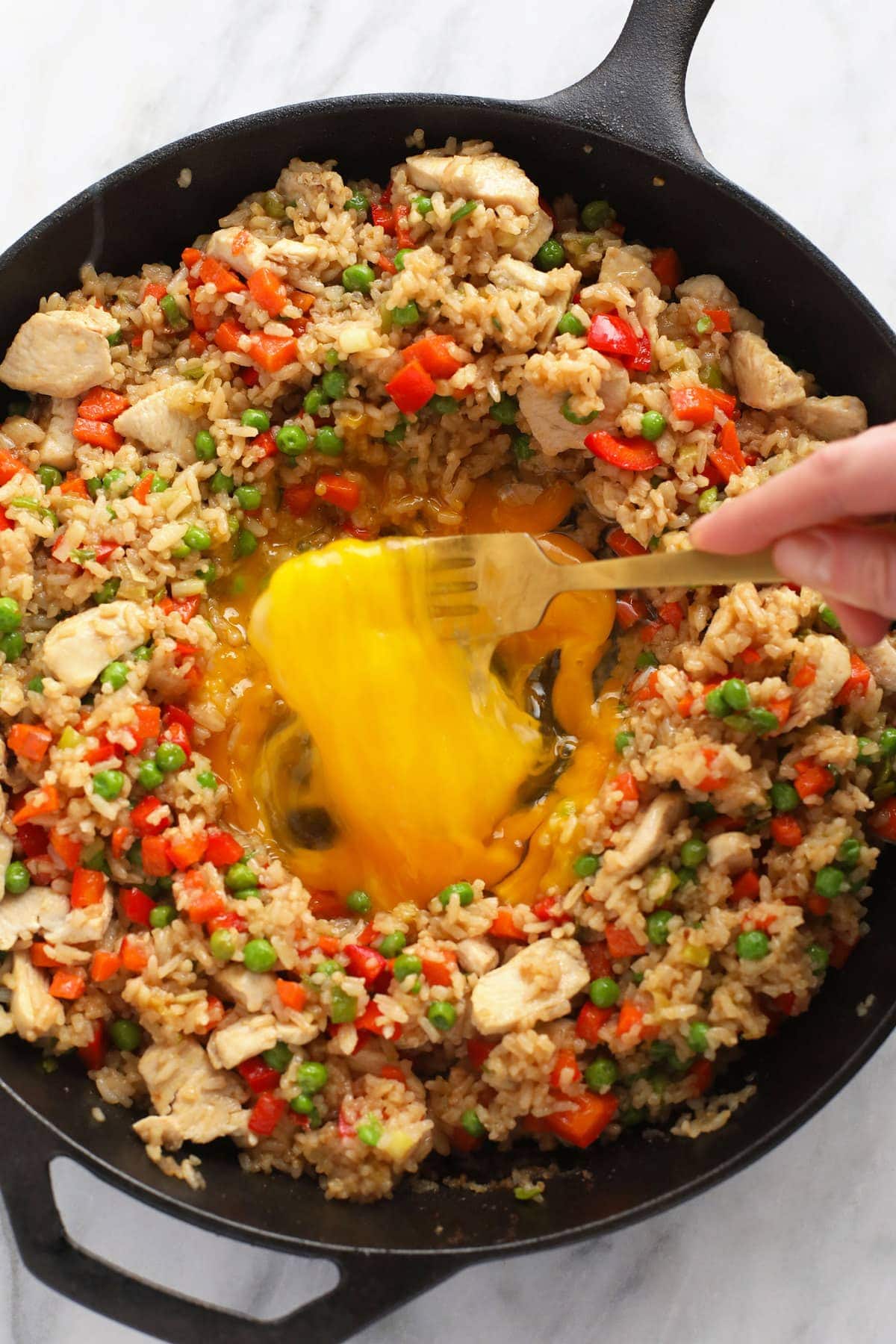 scrambling eggs in the middle of frying pan