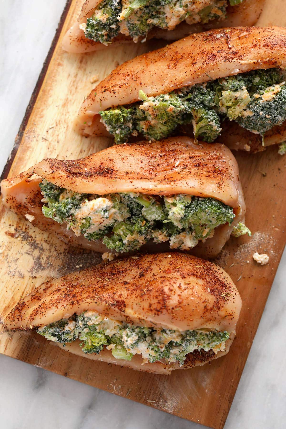 broccoli and cheese stuffed chicken breasts ready to be seared and then baked.