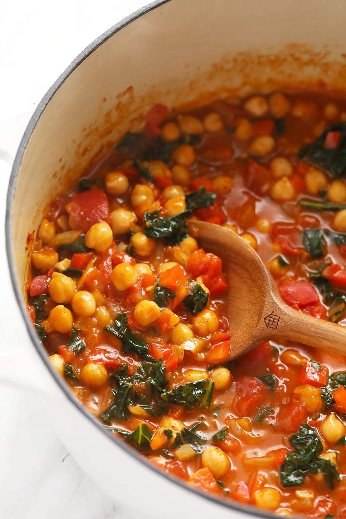 chickpea curry in a dutch oven ready to be spooned into 