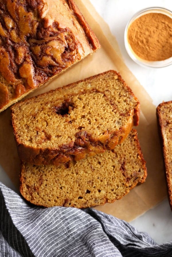 Cinnamon swirl slices on a cutting board.