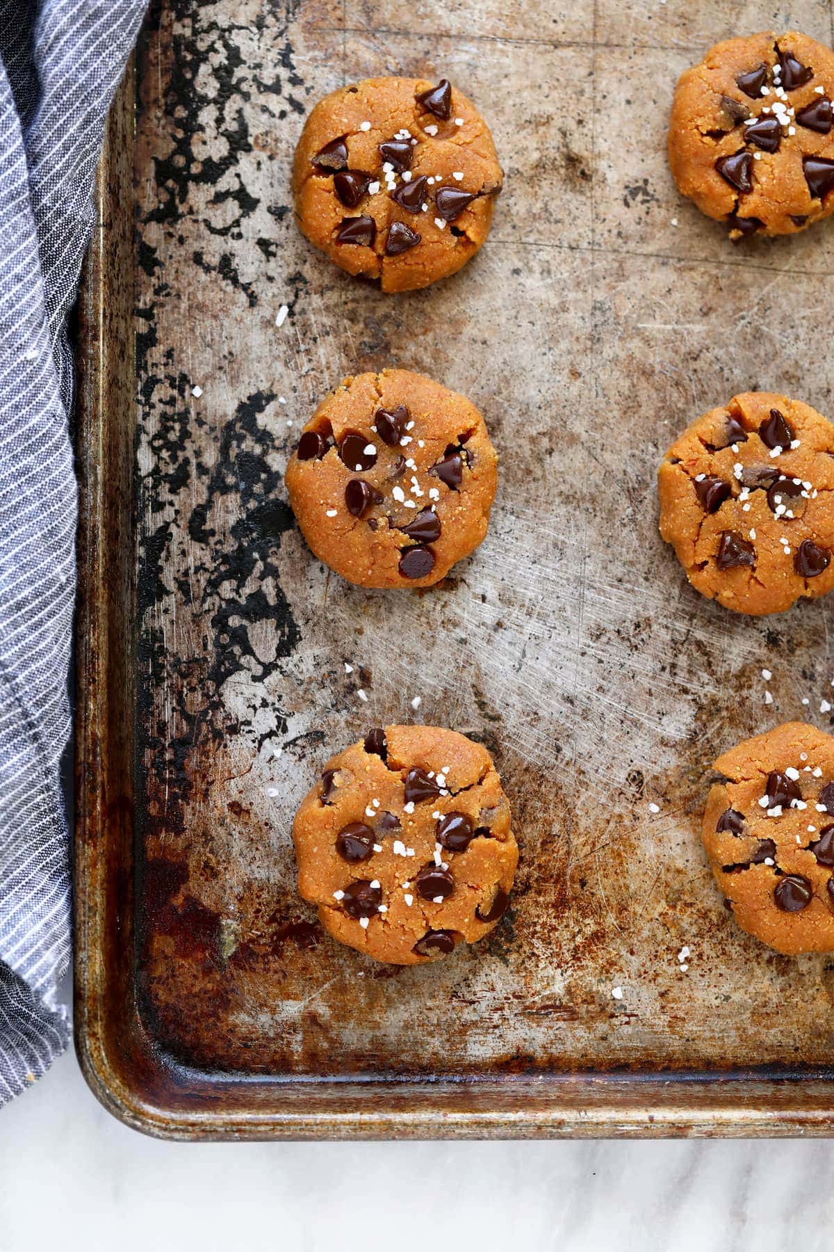 healthy peanut butter cookies on a cookie sheet ready to. be baked