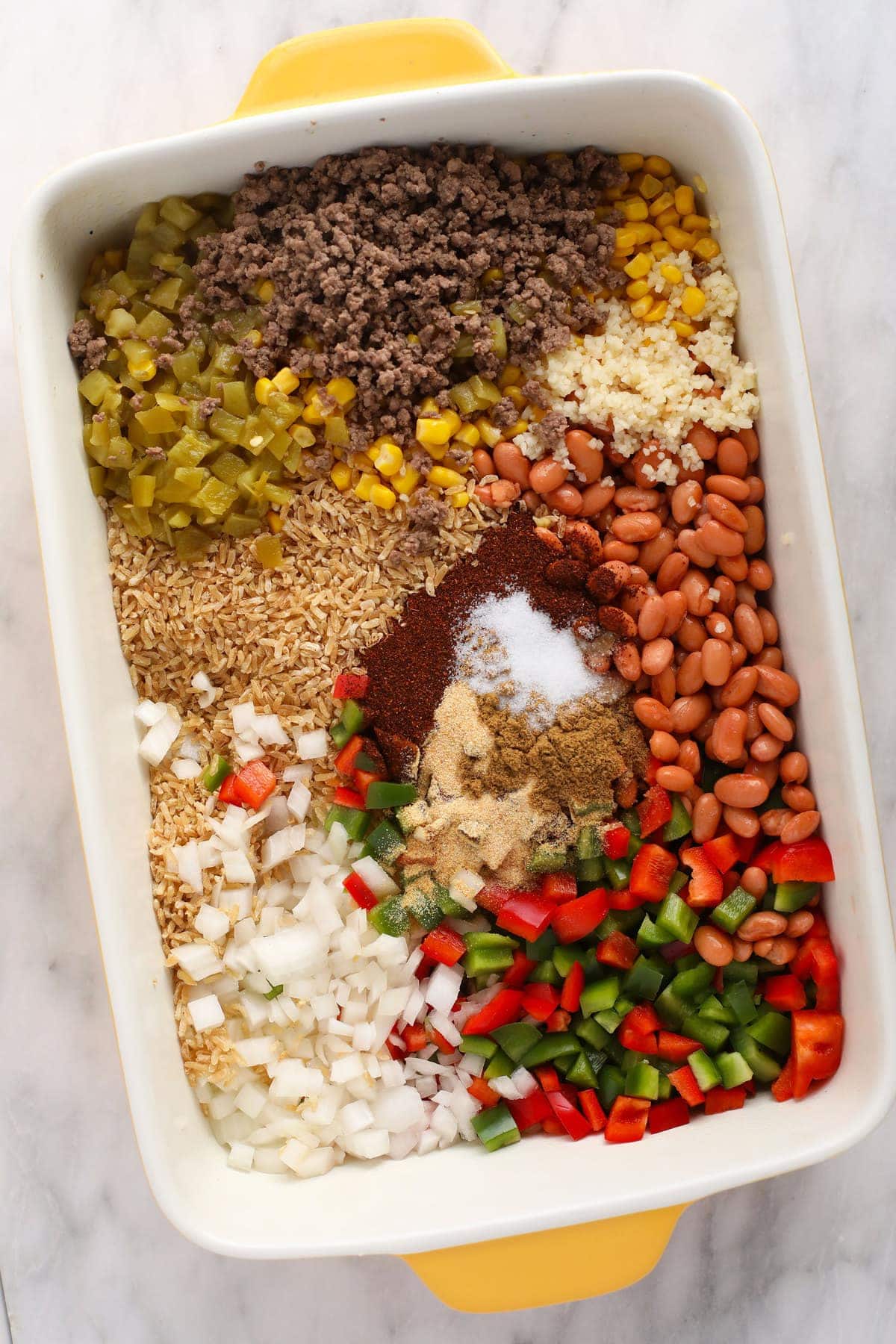 All the ingredients for an easy Mexican casserole in a casserole dish. 