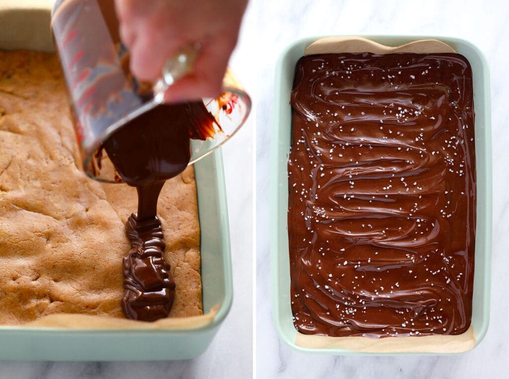 pouring chocolate topping on homemade protein bars