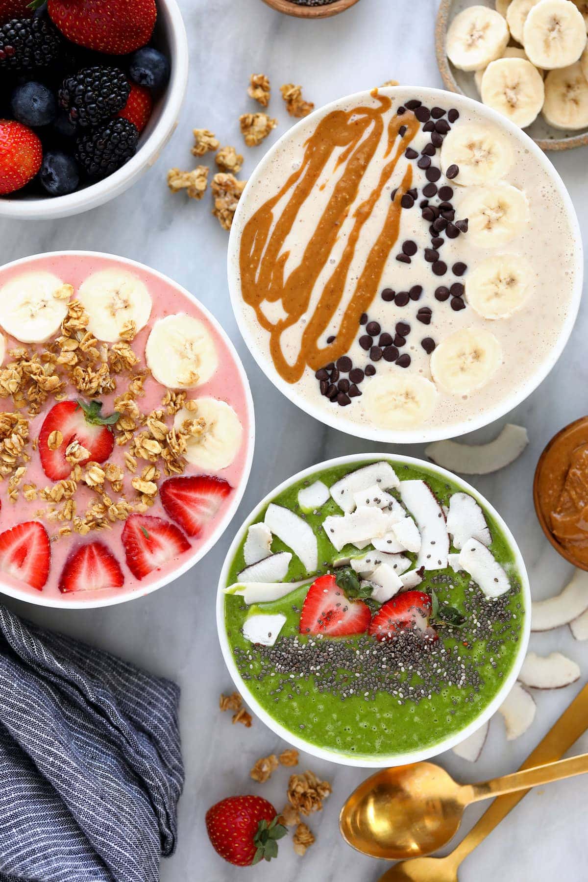 3 smoothie bowls with toppings