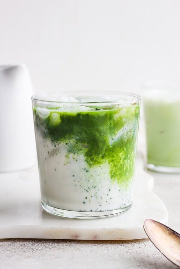 Matcha latte swirled into a almond milk