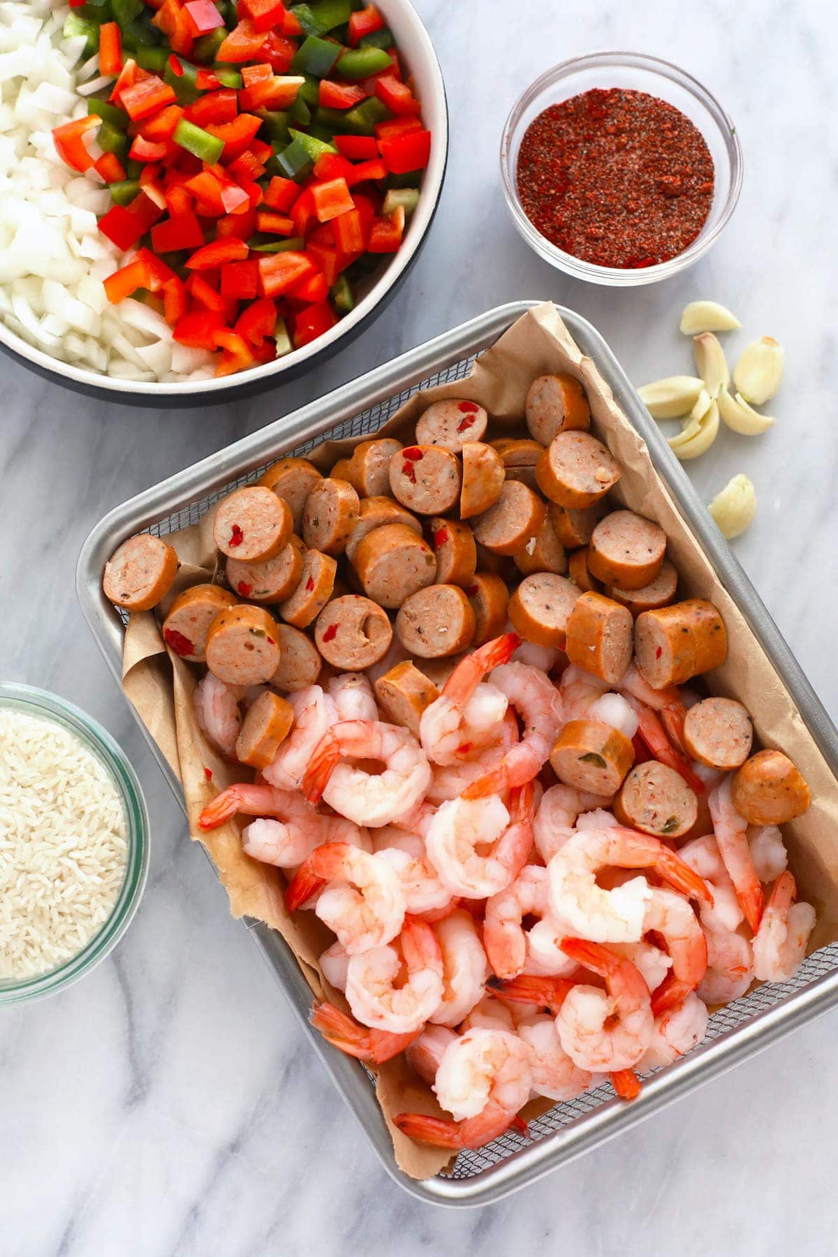 All the ingredients for Instant Pot Jambalaya in bowls. 