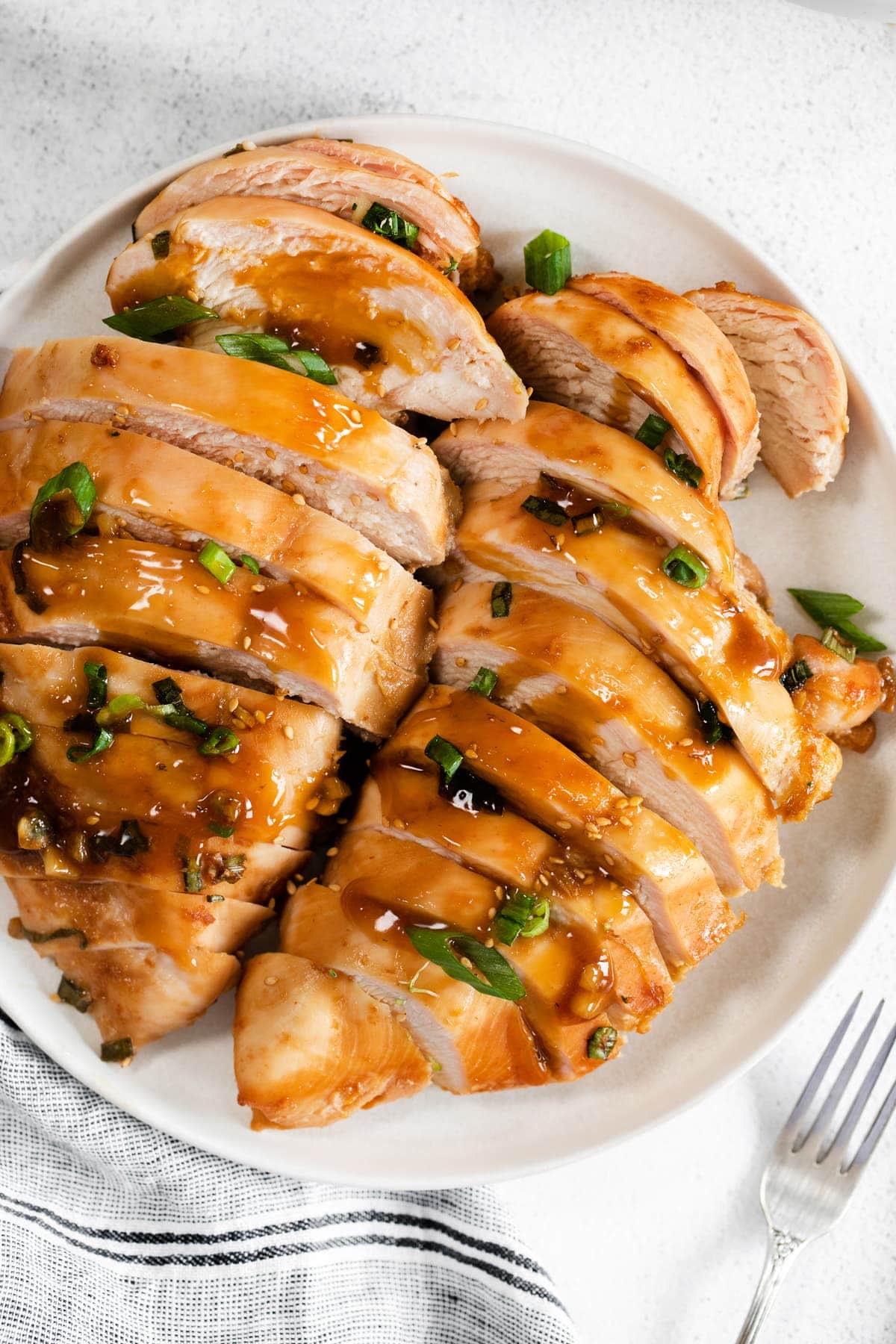 sliced teriyaki chicken on plate